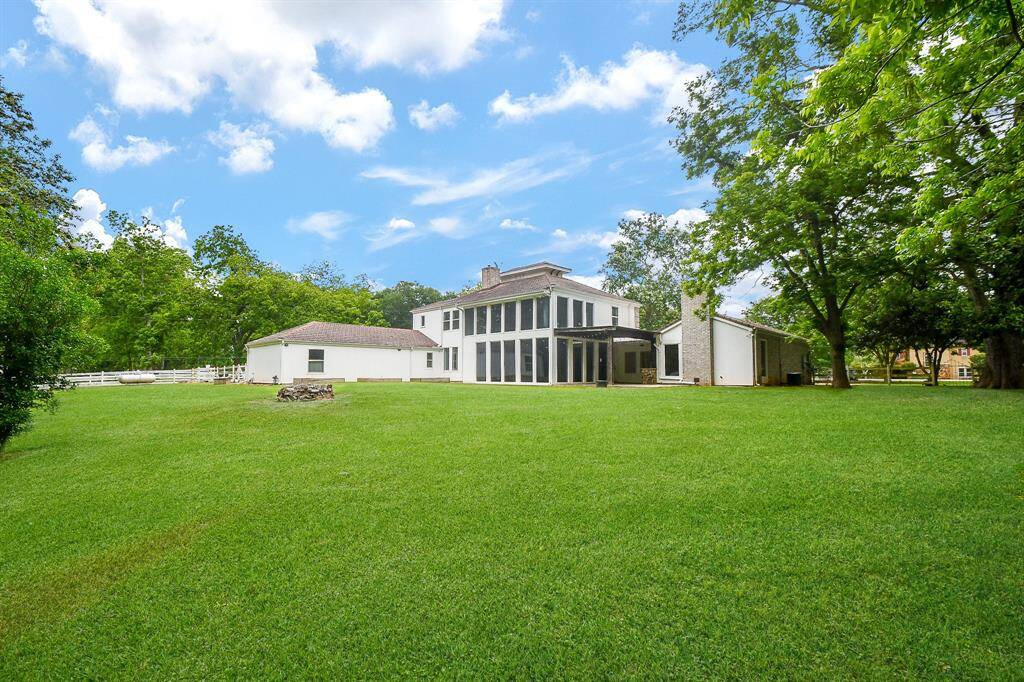 Home sits on 1.76 acres a combination of beautiful green space and mature trees