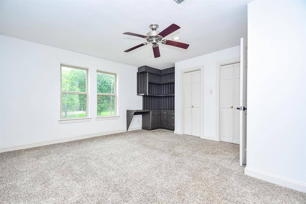 Fourth bedroom offers built in desk area and full bathroom