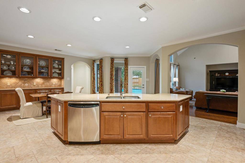 Whether you're hosting a lively gathering or preparing a quiet family dinner, this beautifully appointed kitchen, overlooking the family room, offers exceptional space, a thoughtful layout, and timeless design—creating the perfect environment to inspire your culinary creativity.