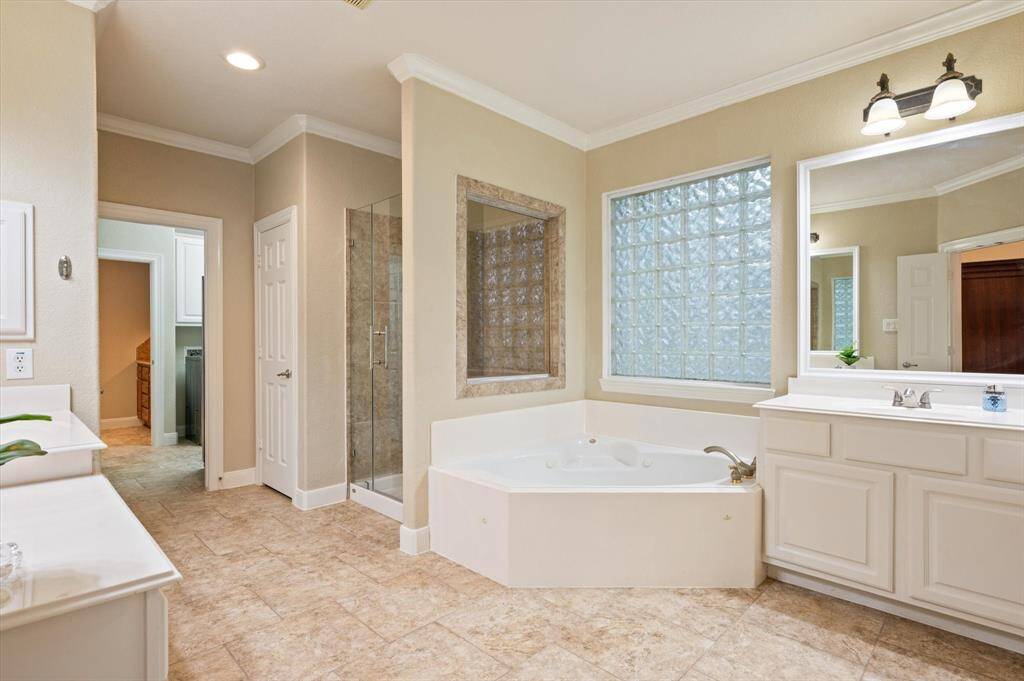 The spa-like ensuite bathroom is a true haven of relaxation, offering a blend of luxury and thoughtful design.