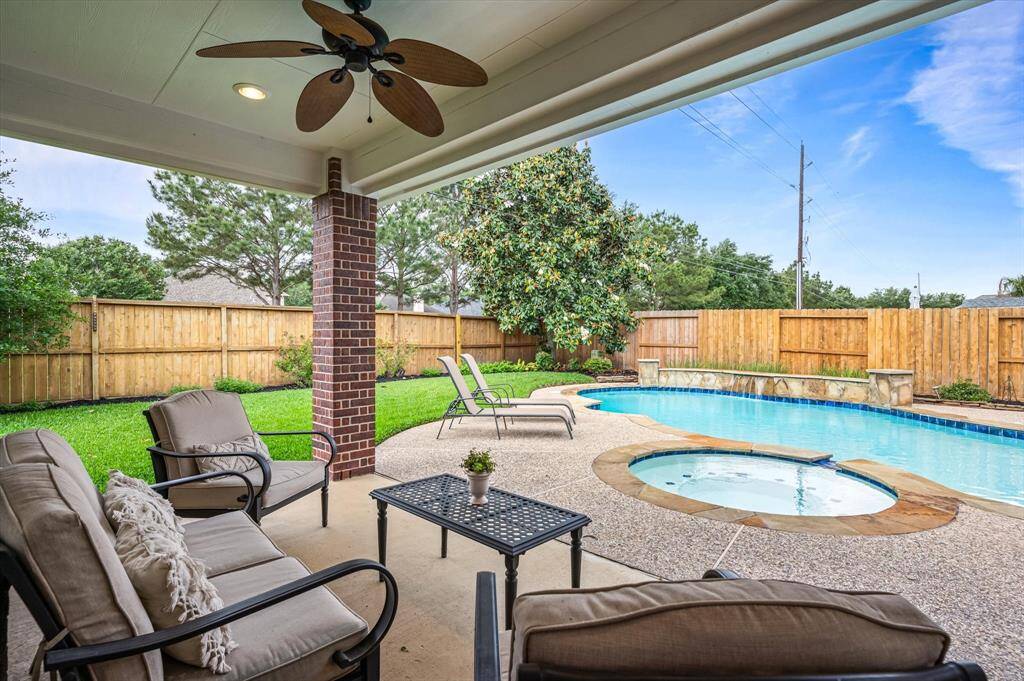 Step outside into your own private backyard oasis, where comfort, relaxation, and outdoor fun await. A spacious covered patio provides the perfect shaded retreat for lounging, dining, or entertaining, all while overlooking the glistening pool and spa.