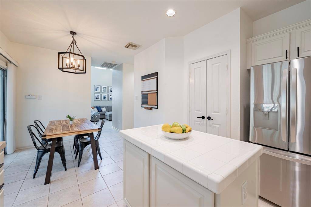 View from kitchen looking toward living room. Nicely sized Pantry and ample storage under island.