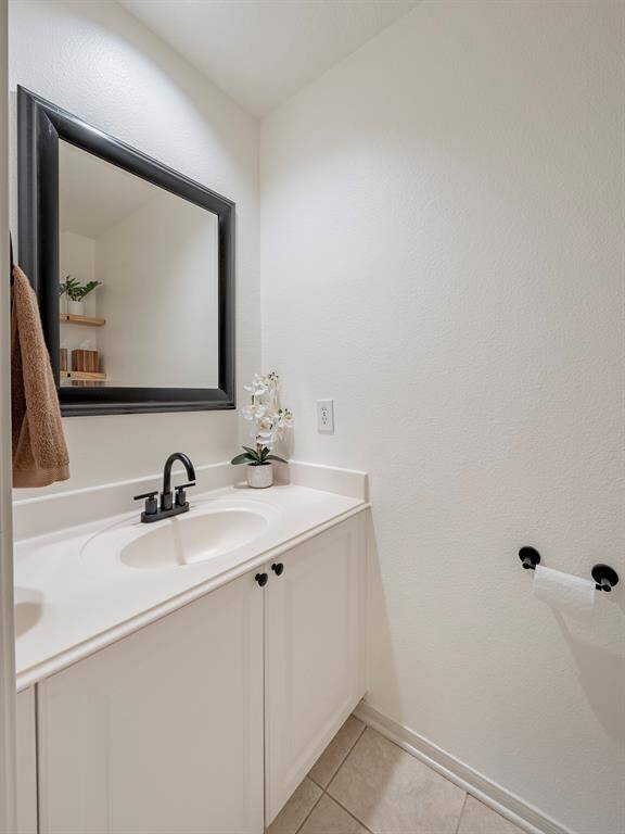 Half bath located just off the kitchen. Very convenient and secluded for guests.