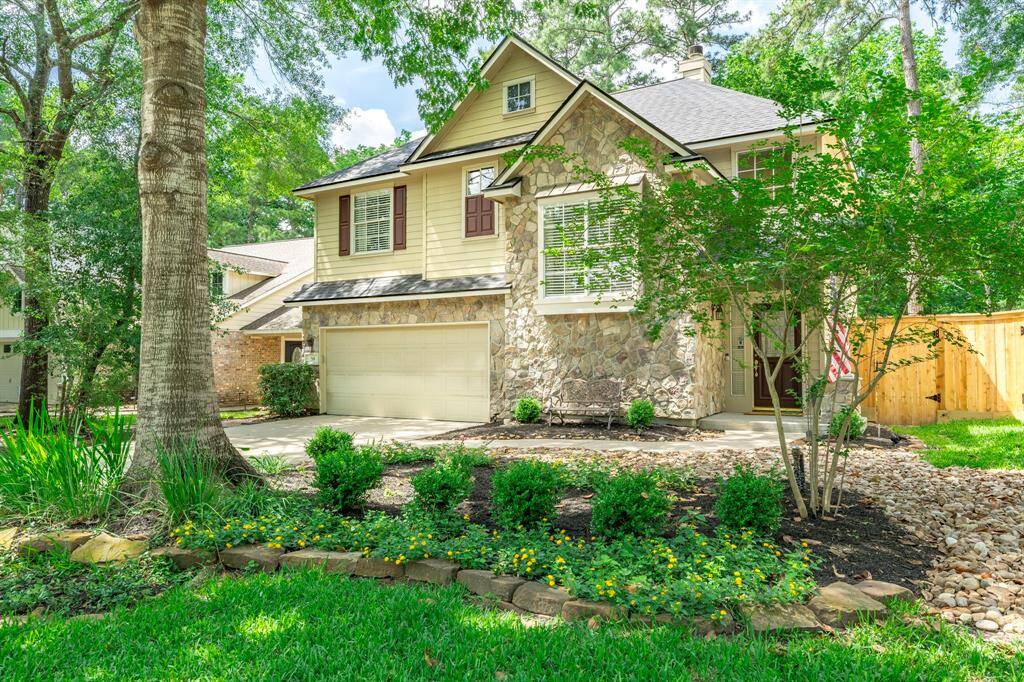 Beautifully maintained front yard greets you!