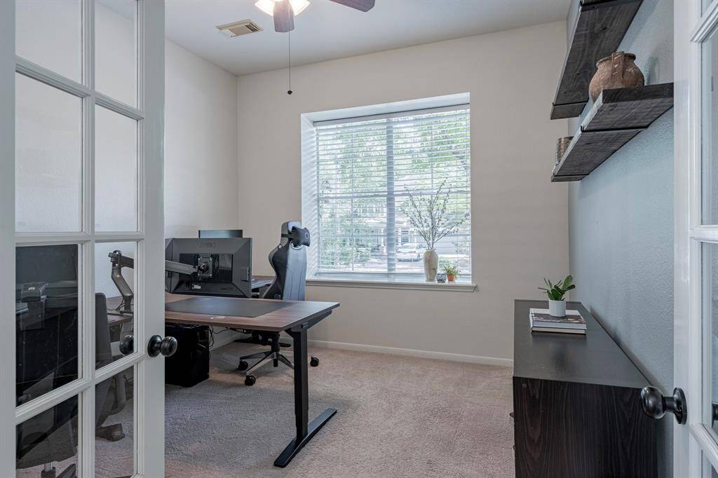 Halfway up stairs, you will find another versatile room. Currently used as a home office, this space has been used as a study, 4th bedroom, playroom and nursery in the past.