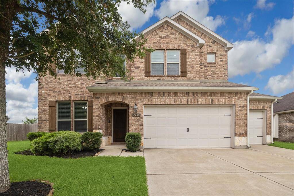 You’ll be welcomed home by timeless curb appeal, featuring a classic brick exterior, wood-accent shutters, and manicured landscaping. Enjoy ample off-street parking for you and your guests with a triple-wide driveway and an oversized three-car garage, offering plenty of space for vehicles, storage, or a home workshop.