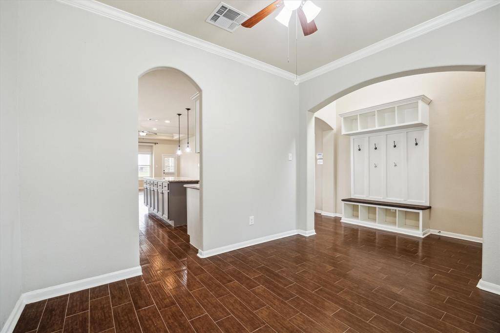 Arched doorways add architectural charm and provide easy access to the kitchen for effortless entertaining.