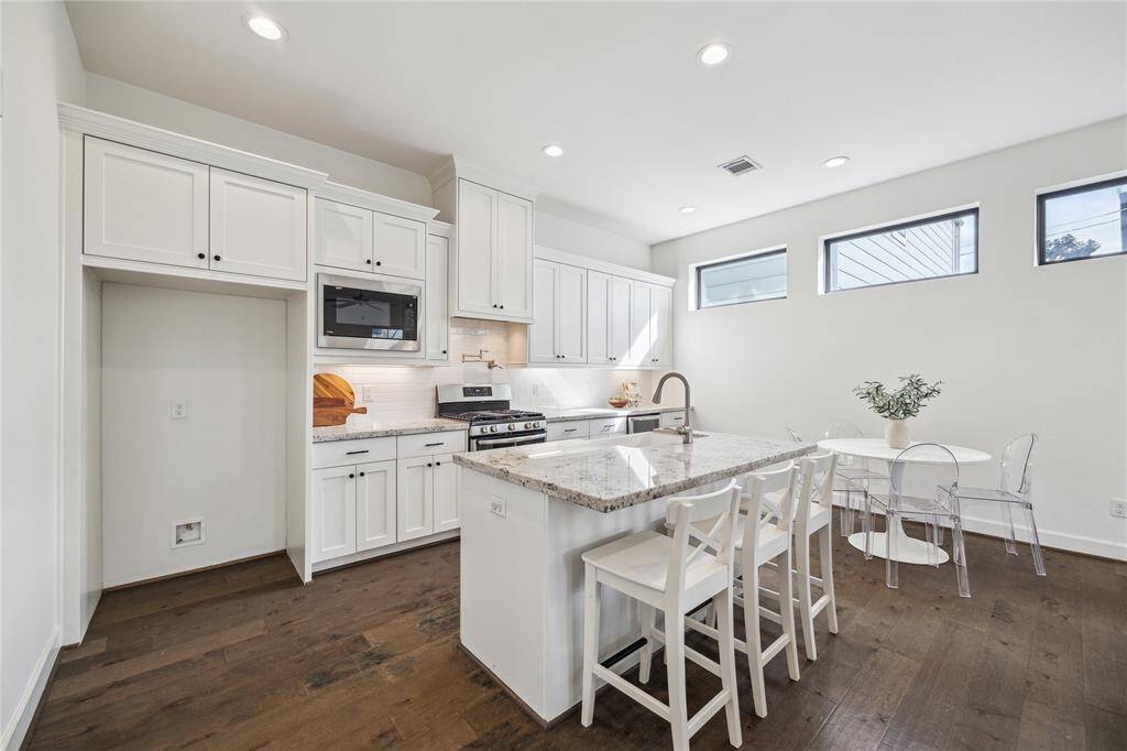 Kitchen is complete with granite countertops, stainless steel appliances, and a HUGE walk-in pantry.