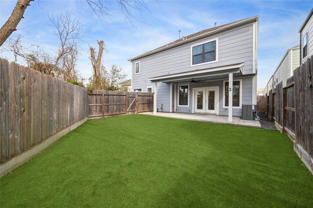 This beautiful end unit offers a spacious backyard and covered patio.