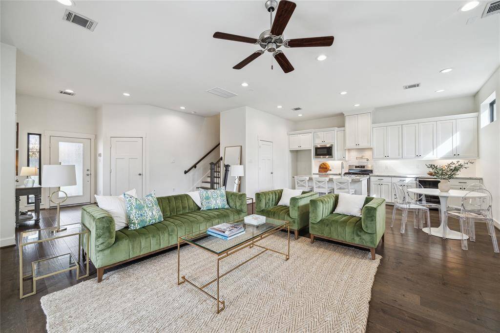 Another perspective of the living area. Note the seamless flow to the island kitchen and dining area.