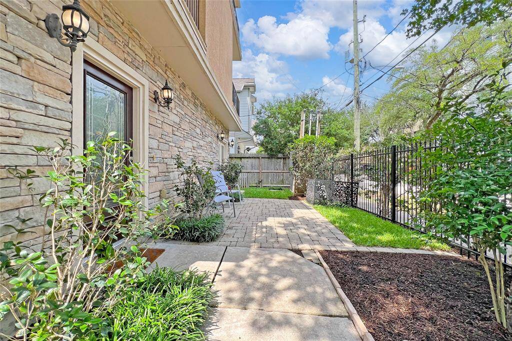 Nestled in a private enclave, enjoy your own serene courtyard and small yard.