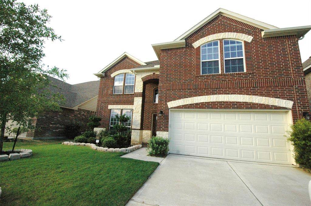 Appealing front yard. House is within walking distance to Seven Lakes Junior High and Seven Lakes High School, as well as lakes, bike trails, tennis court etc.