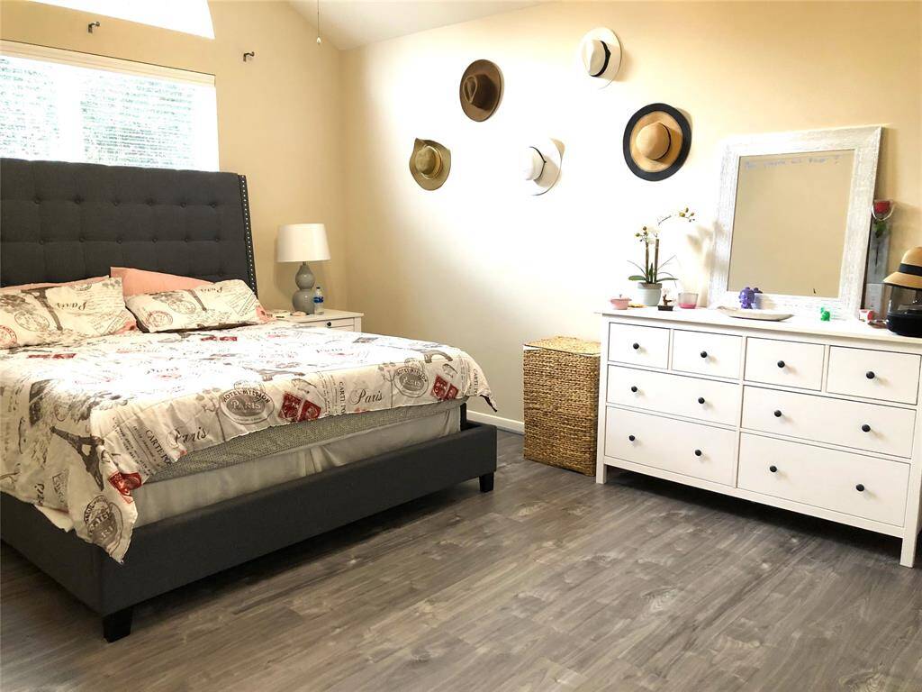 Master bedroom before replacement of floors, with furniture for reference.