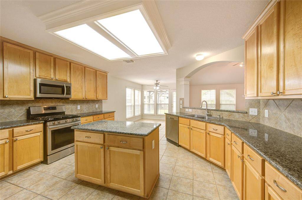 Island in the kitchen for more counter space and storage