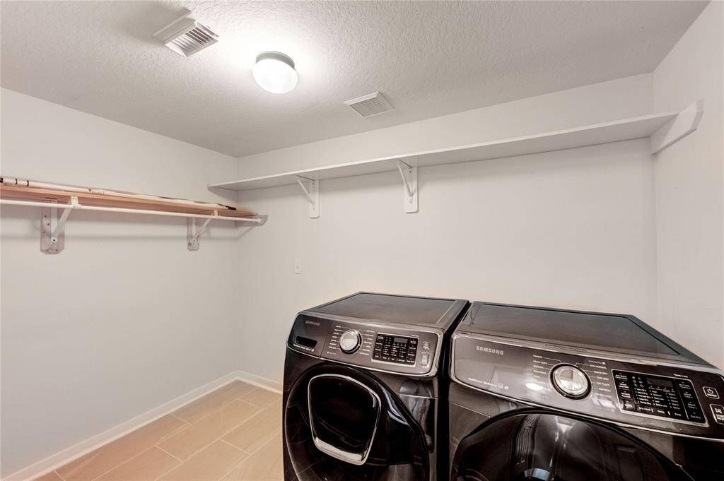 Large Utility room that cones with Samsung washer and dryer