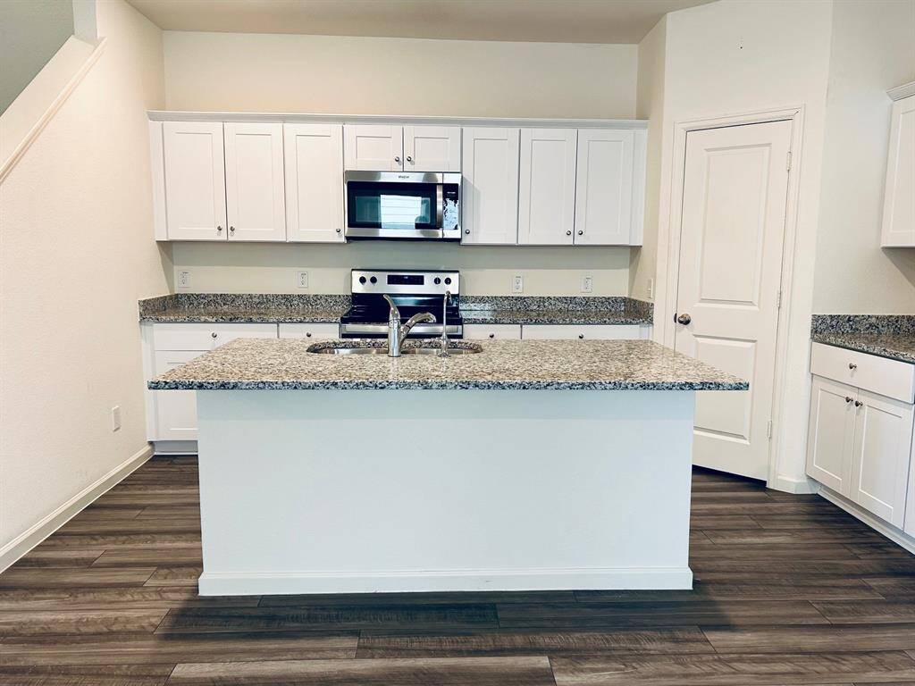 Kitchen with granite countertops.