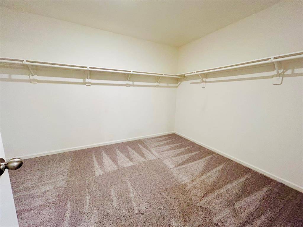 Primary walk in closet.