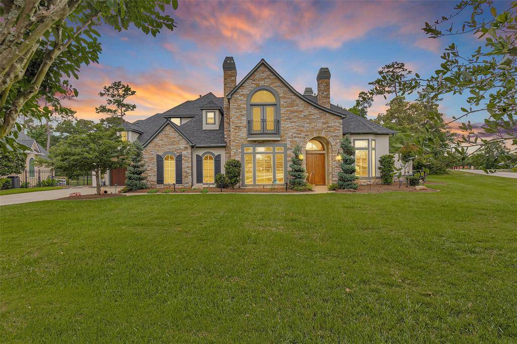 Welcome to 7015 Augusta Pines Cove, where timeless French Country charm meets modern luxury on a premier golf course lot.