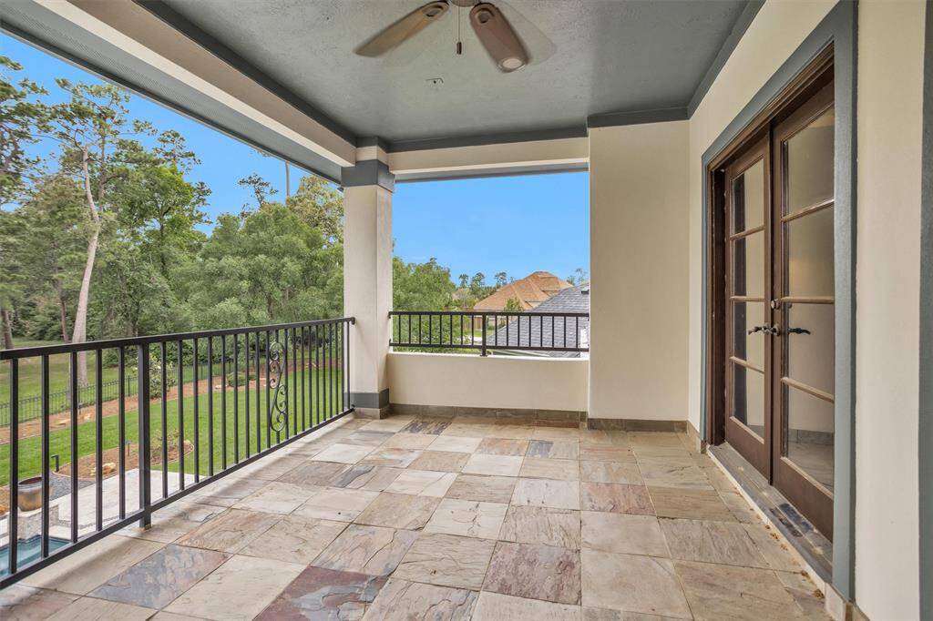 Just off the game room, the upstairs balcony offers a peaceful retreat overlooking the spacious backyard and pool retreat.