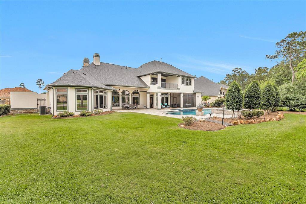 Take in the view from every angle. The backyard offers multiple seating zones, lush landscaping, and a private gate with golf course access.
