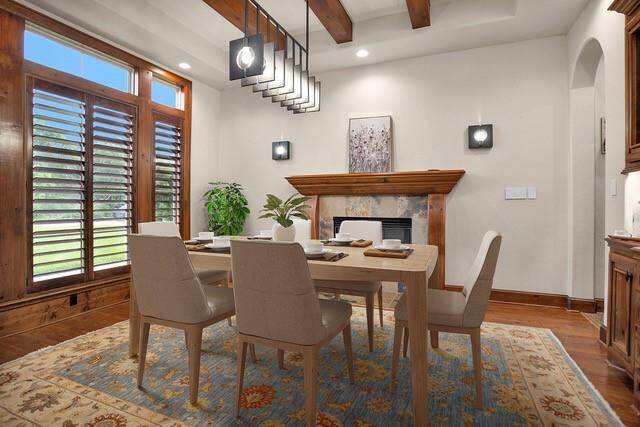 This virtually staged image highlights the room's potential as a formal dining space—perfectly placed just off the entry with elegant architectural details and ample natural light for hosting memorable meals.