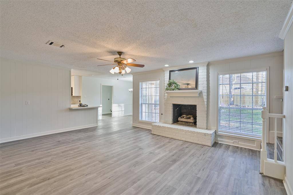 Family room is large with fireplace and lots of natural light.