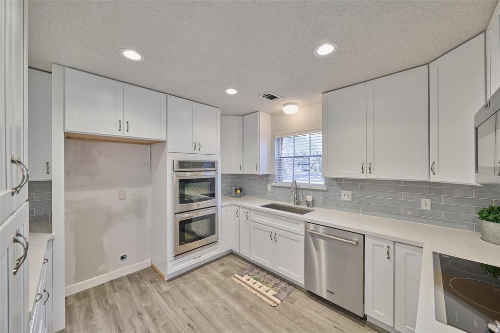 All new stainless appliances and fresh kitchen