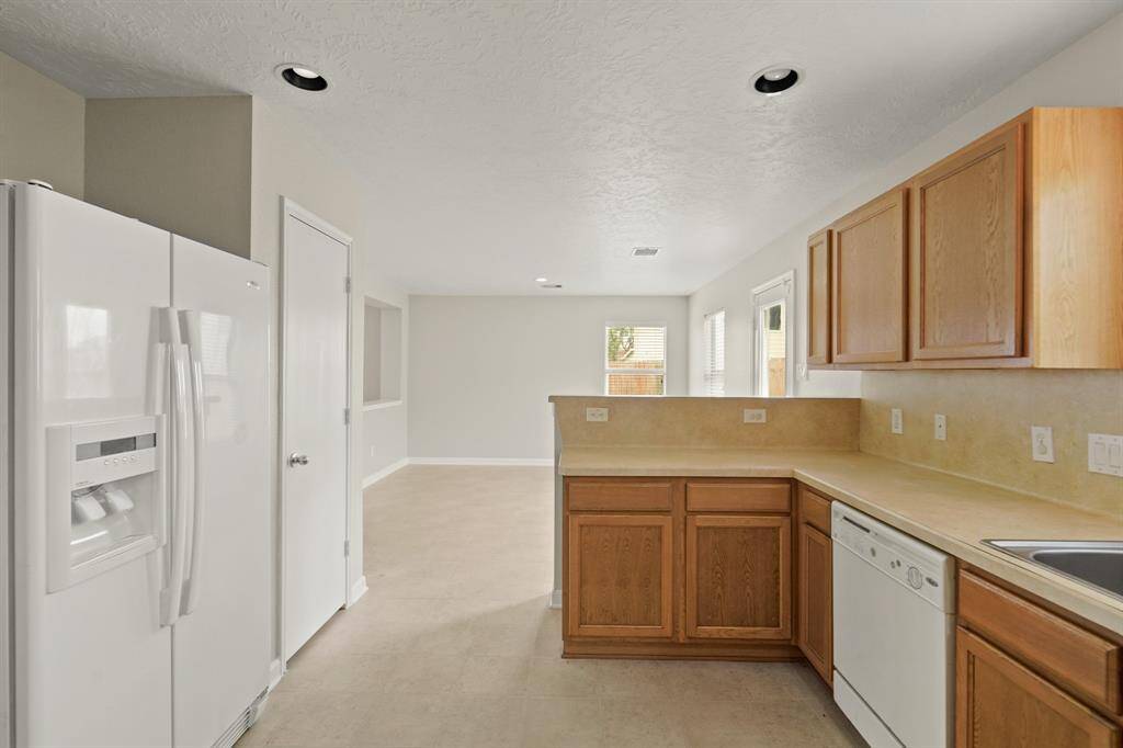 The kitchen and dining areas are seamlessly connected.