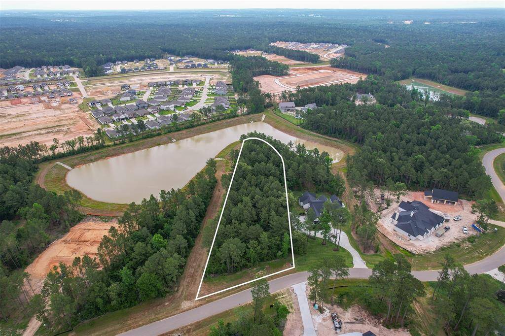 Panoramic views surround this rare lakefront lot, offering a peaceful, private setting with water on three sides—truly a one-of-a-kind opportunity.