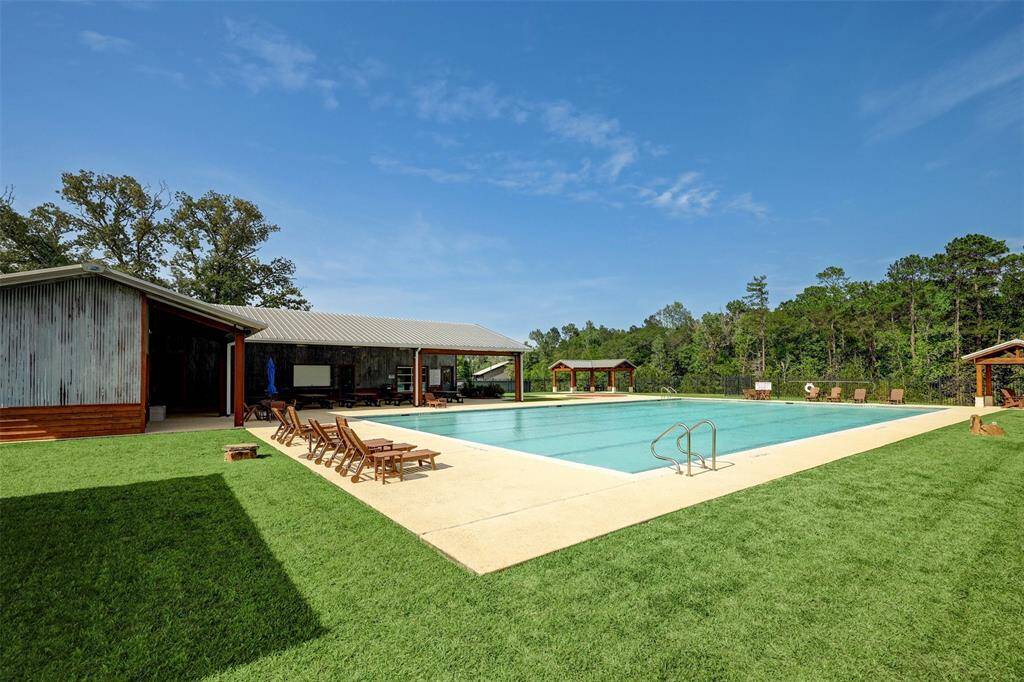 The inviting community pool offers a peaceful escape, surrounded by nature and perfect for cooling off on warm Texas afternoons.