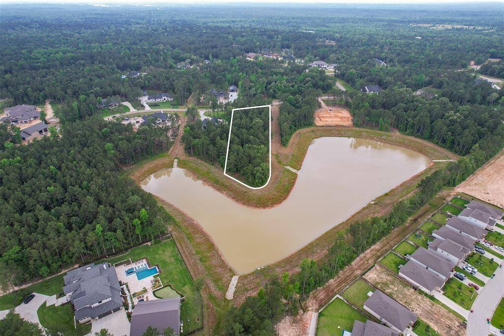 Framed by the serene lake, the lot provides endless opportunities for outdoor living with breathtaking water views in nearly every direction.