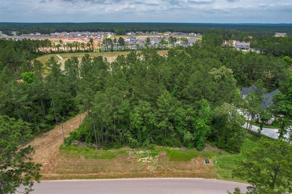 Stunning views from every angle—this lot captures the very best of lakeside living in a beautifully maintained neighborhood.