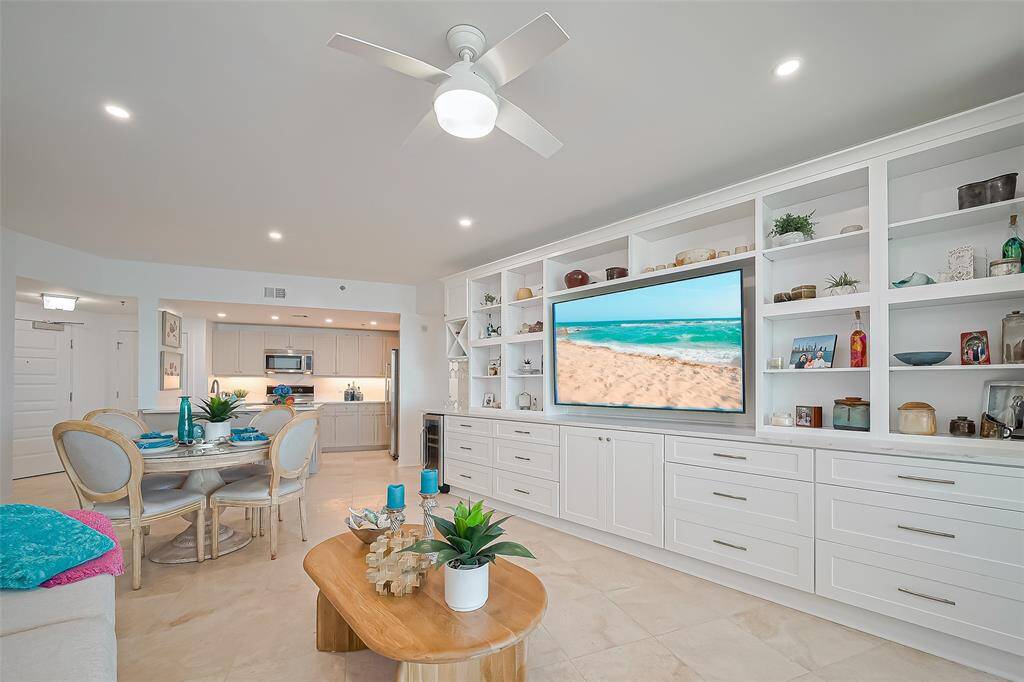 CUSTOM BUILT IN ENTERTAINMENT CENTER WITH TONS OF STORAGE AND SPACE TO DISPLAY YOUR FAVORITE PIECES.  ALSO FEAUTURES A QUARTZ COUNTERTOP, WINE FRIDGE AND WINE GLASS RACK.