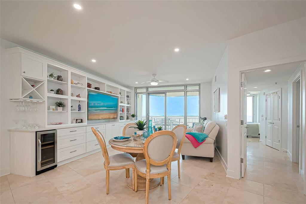 NEW LUXURY TRAVERTINE FLOORING THROUGHOUT, NEW CEILING FANS, NEW LIGHTING AND BEAUTIFUL BUILT-IN WALL UNIT.