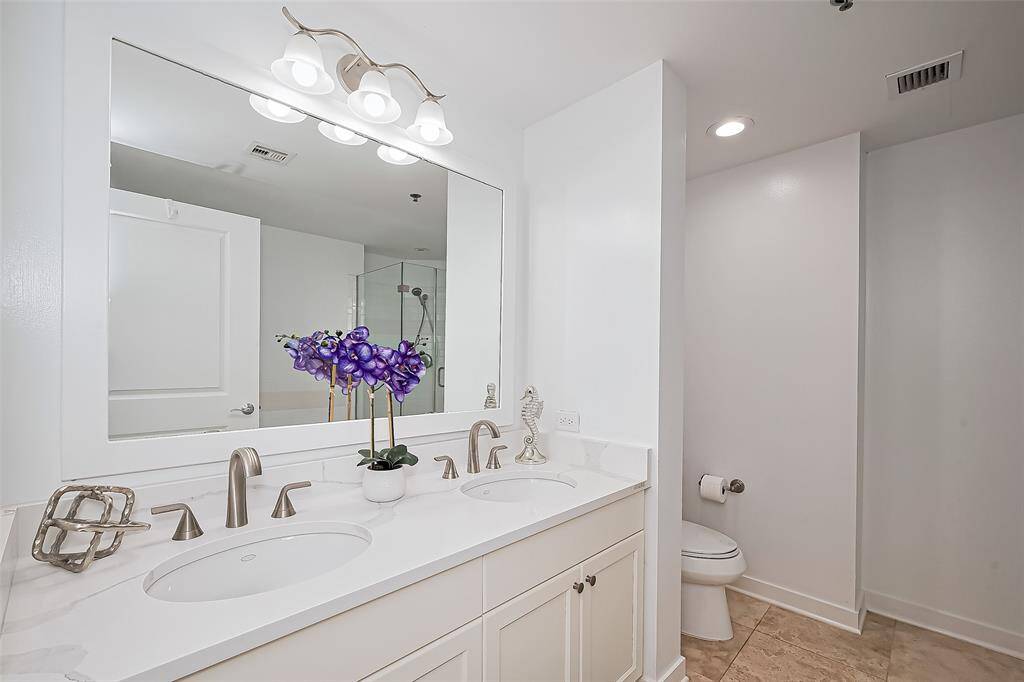 MASTER BATH REMODELED WITH NEW DOUBLE QUARTZ SINKS AND COUNTERTOPS, CUSTOM BATHROOM FIXTURES AND LIGHTING.
