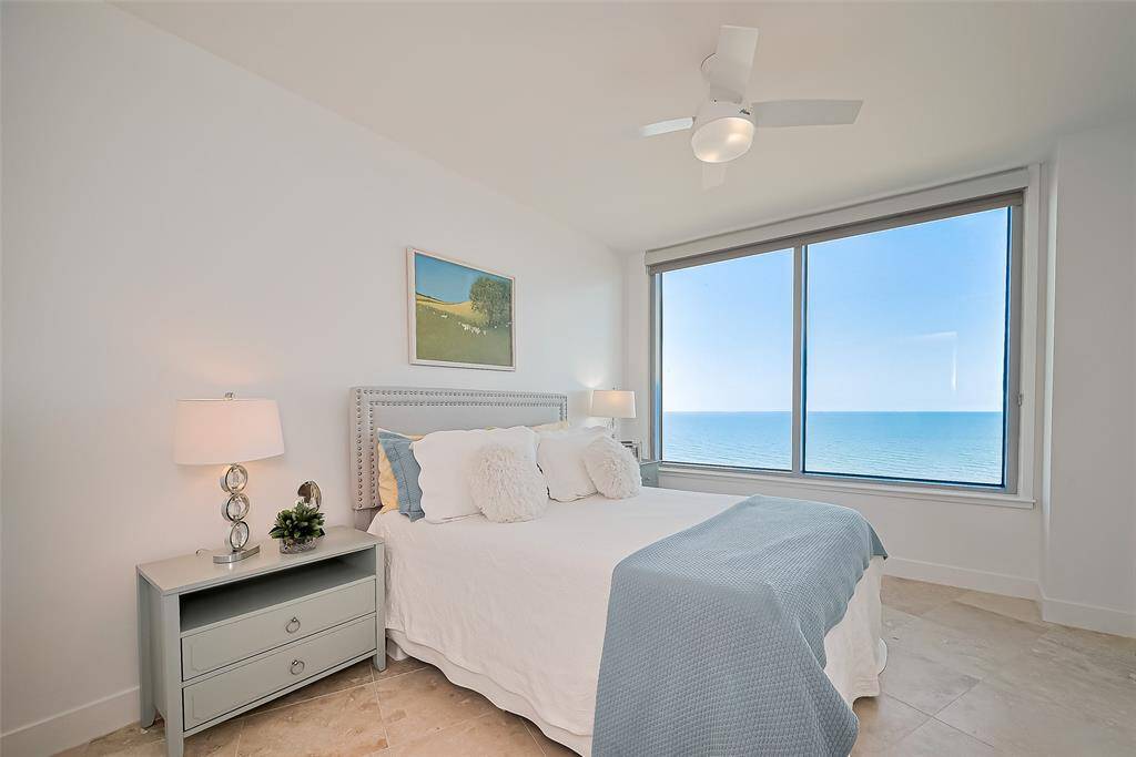 LARGE SECONDARY BEDROOM WITH UNBELIEVABLE VIEWS OF THE GULF. RARE 10 FT CEILINGS AND TRAVERTINE FLOORING THROUGHOUT CONDO.