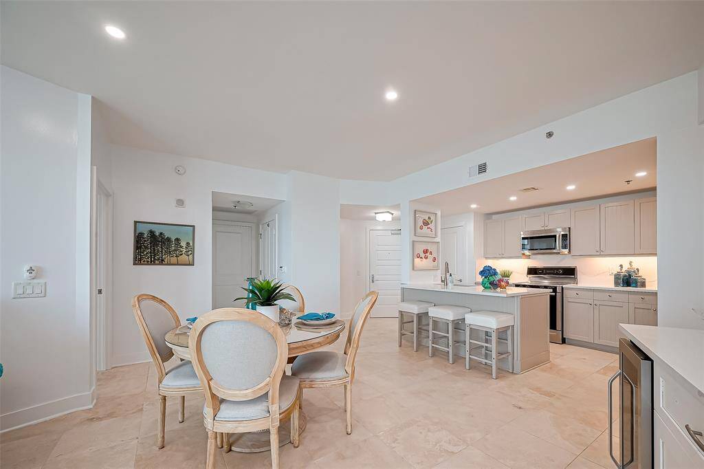 TRAVERTINE FLOORING THROUGHOUT, FRESHLY PAINTED WALLS AND CEILINGS AND DECORATOR TOUCHES!!!