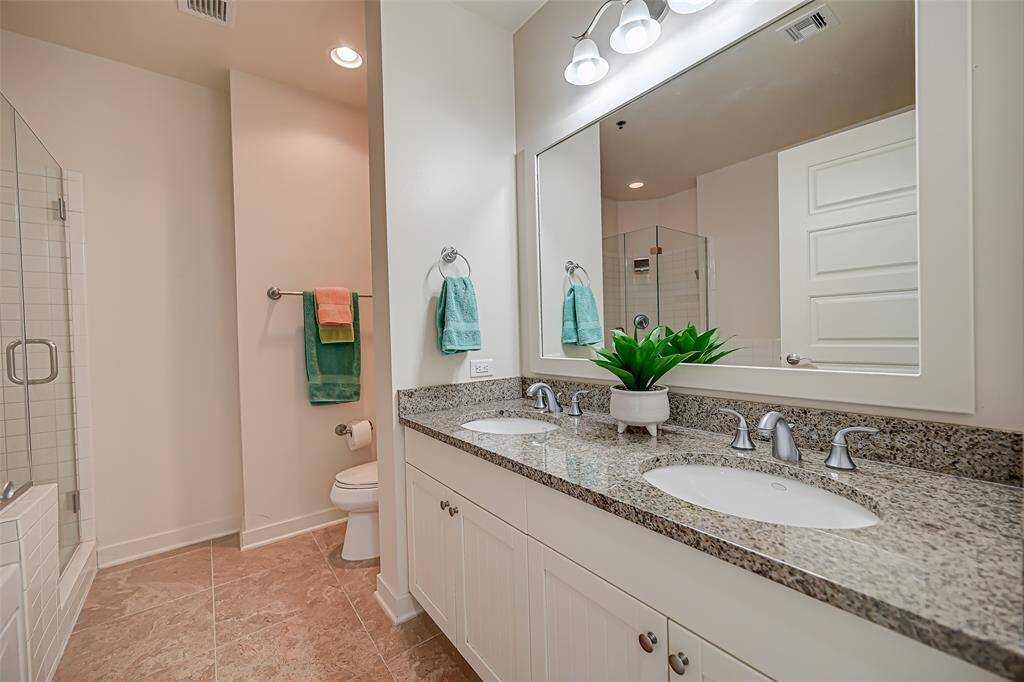 Expansive walk-in closet with custom shelving.