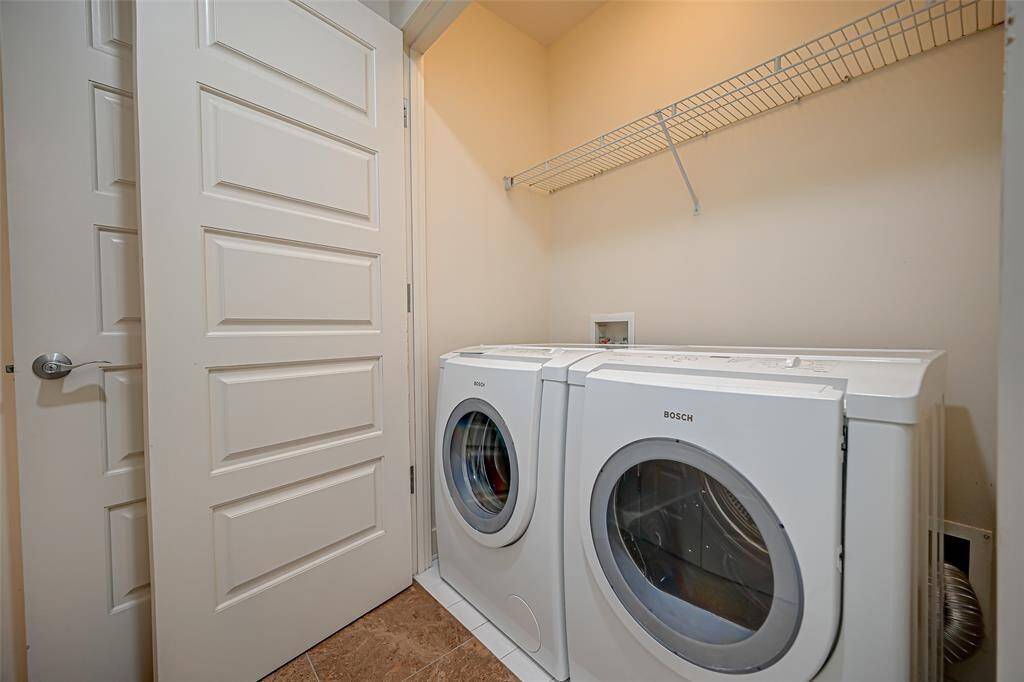 Conveniently located near the den, this elegant half bath features sleek granite countertops.