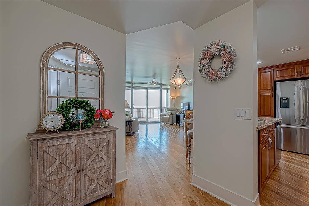 This unit has numerous custom features and upgrades (granite countertops, pull out shelving, custom lighting, bamboo flooring, custom kitchen cabinetry, custom window treatments and recent a/c, water heater and comfort toilets (2024).