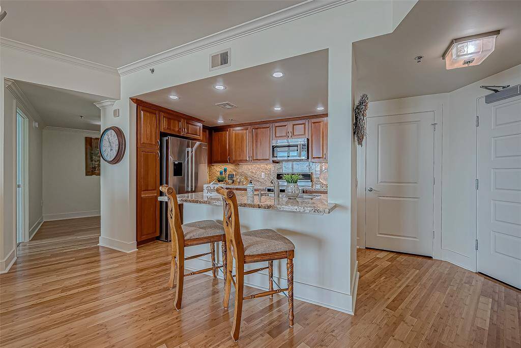 This Dream Kitchen has upgraded cabinetry and lighting, decorator granite countertops and backsplash.