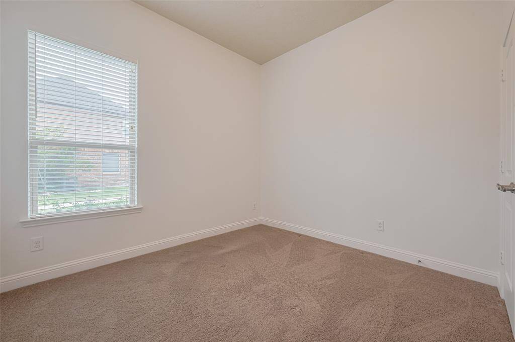 Third bedroom with large window.