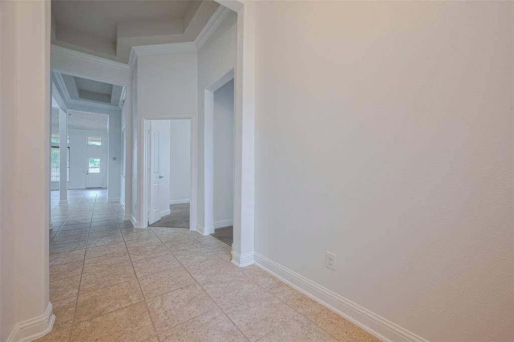 Entry opens to airy main living spaces beyond.
