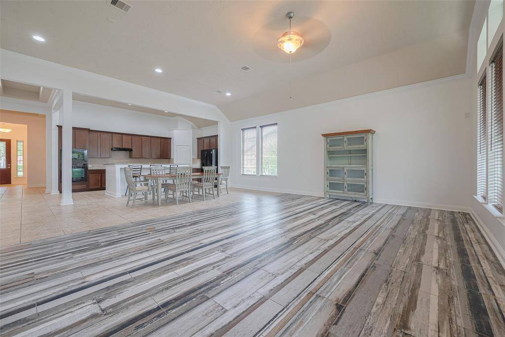 Spacious living room with bold flooring and open flow.