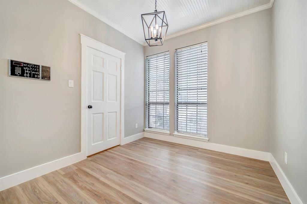 The breakfast area overlooks the front yard and well established tree.