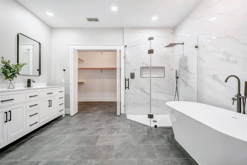 Step into the well thought out primary bath that has been fully remodeled.