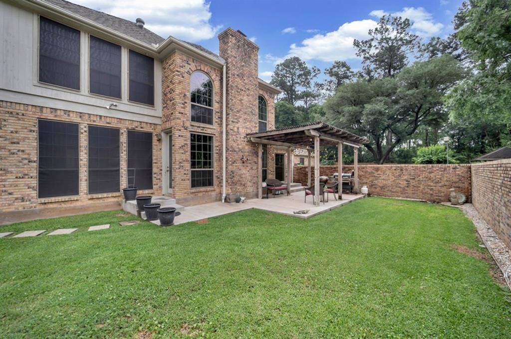 The brick fenced yard offers privacy and is esthetically beautiful