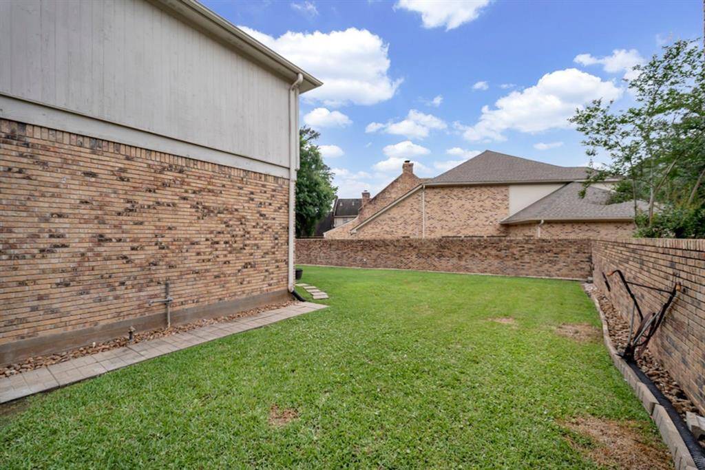 Find a convenient door leading to the garage from the backyard
