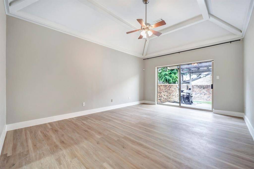 Large primary bedroom is downstairs with a private door to the back patio