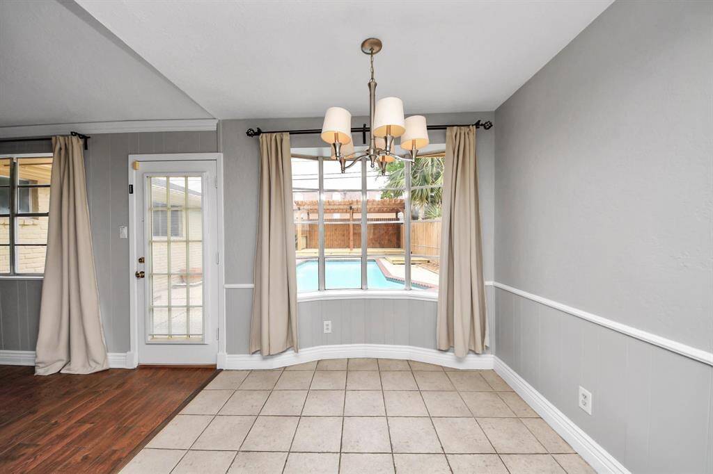 Spacious breakfast nook with poolside views.